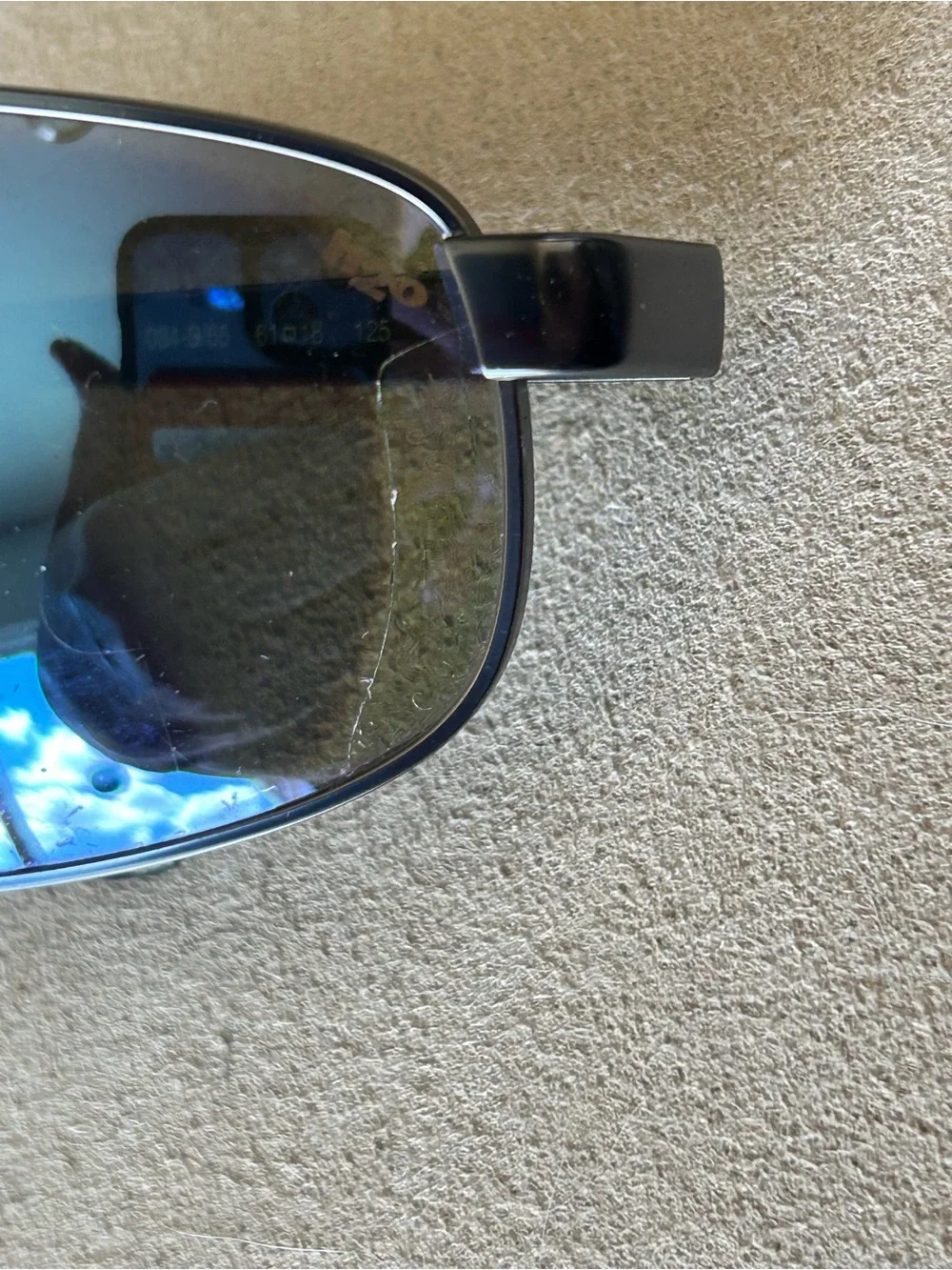 Revo Polarized Sunglasses — Black Frame with Blue Logo